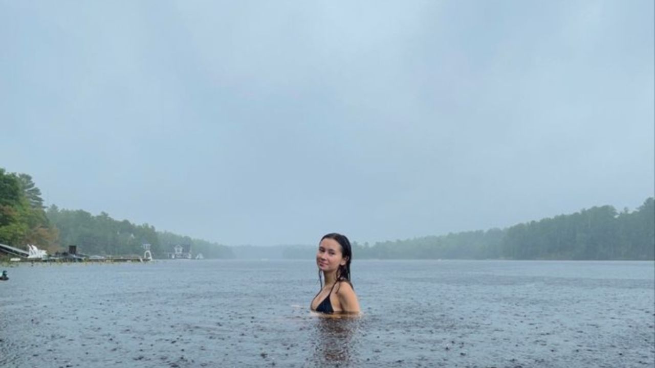 female swimming in Gold Coast waterways in the rain