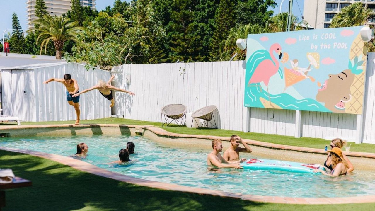 Hostel guests nejoying hostel pool facilities