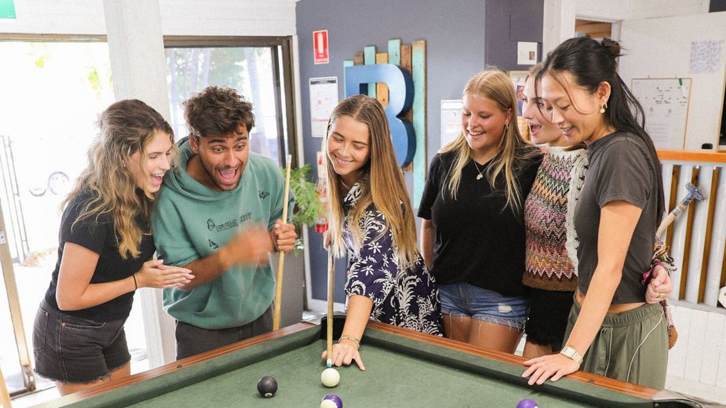 Hostel guests enjoying playing pool at Budds in Surfers